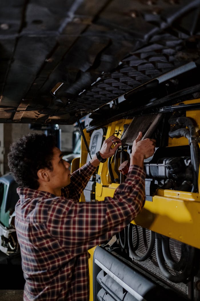 Diesel mechanic servicing a truck for Power Diesel Road Services’ reliable roadside assistance and efficient repairs.